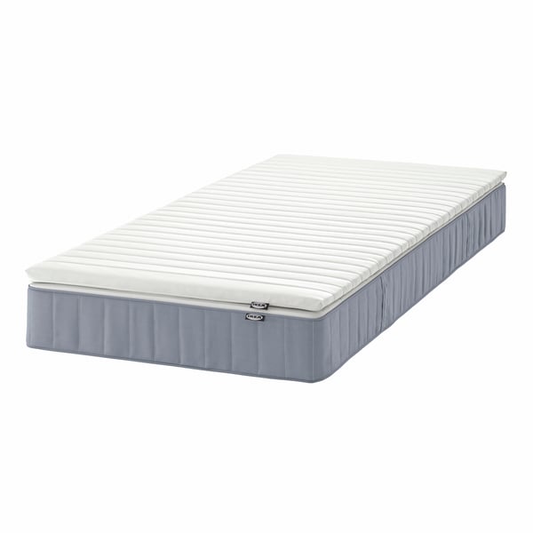A firm light blue/Näsfjället white VESTERÖY mattress and mattress pad