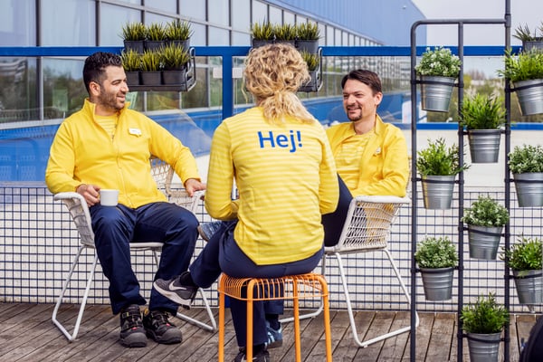 Several people enjoying a break together with a coffee.