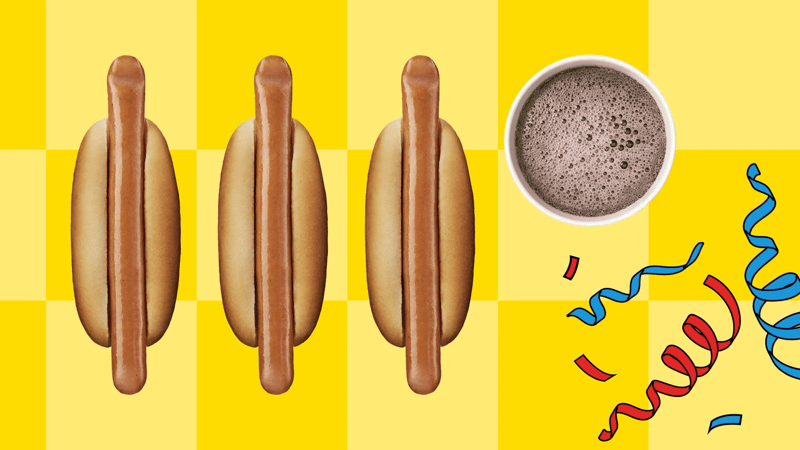 Kolme hot dogia ja virvoitusjuoma keltaisen taustan edessä.
