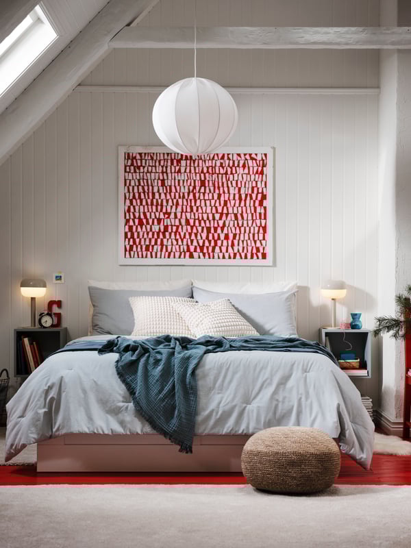 A light grey-blue EKET cabinet in the bedroom