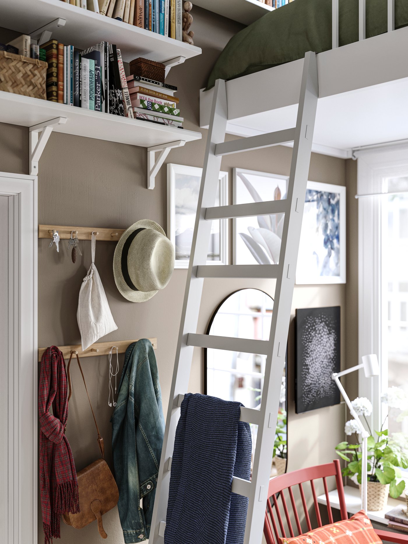White-stained aspen TRANHULT shelves with SANDSHULT brackets are wall-mounted above two HÖVOLM racks with six knobs each.