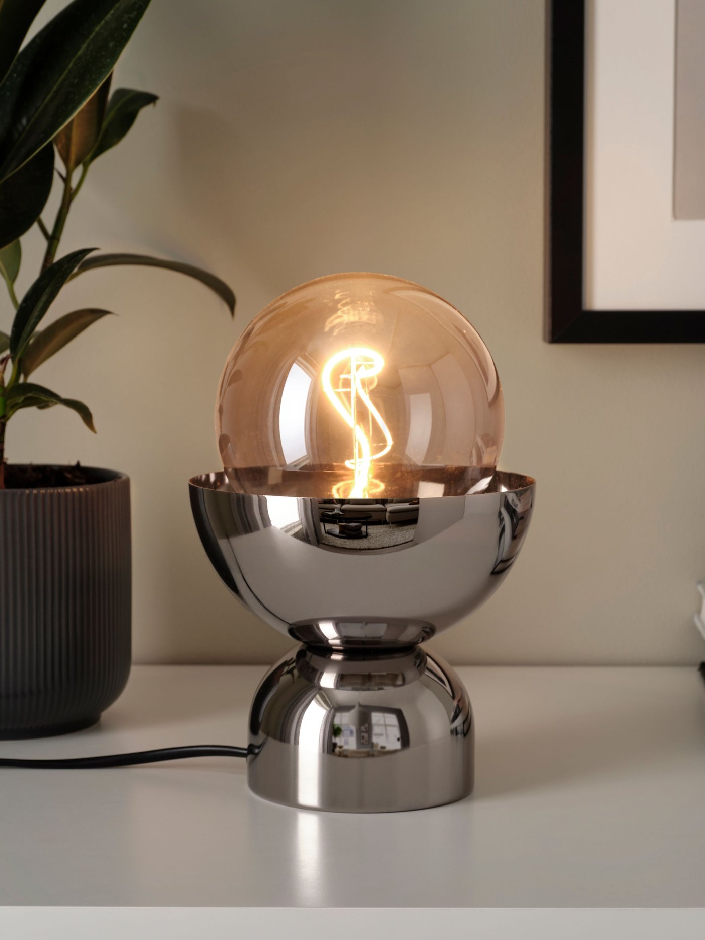 A nickel-plated ACKJA table lamp