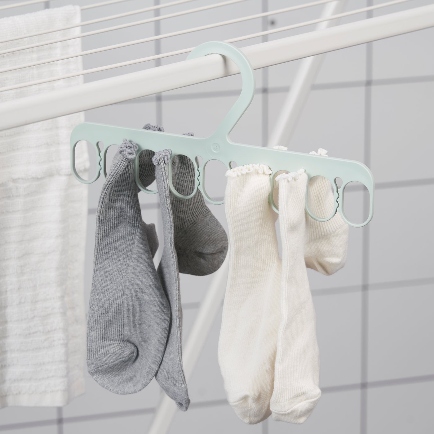 A green SLIBB hanger with 8 grip clips