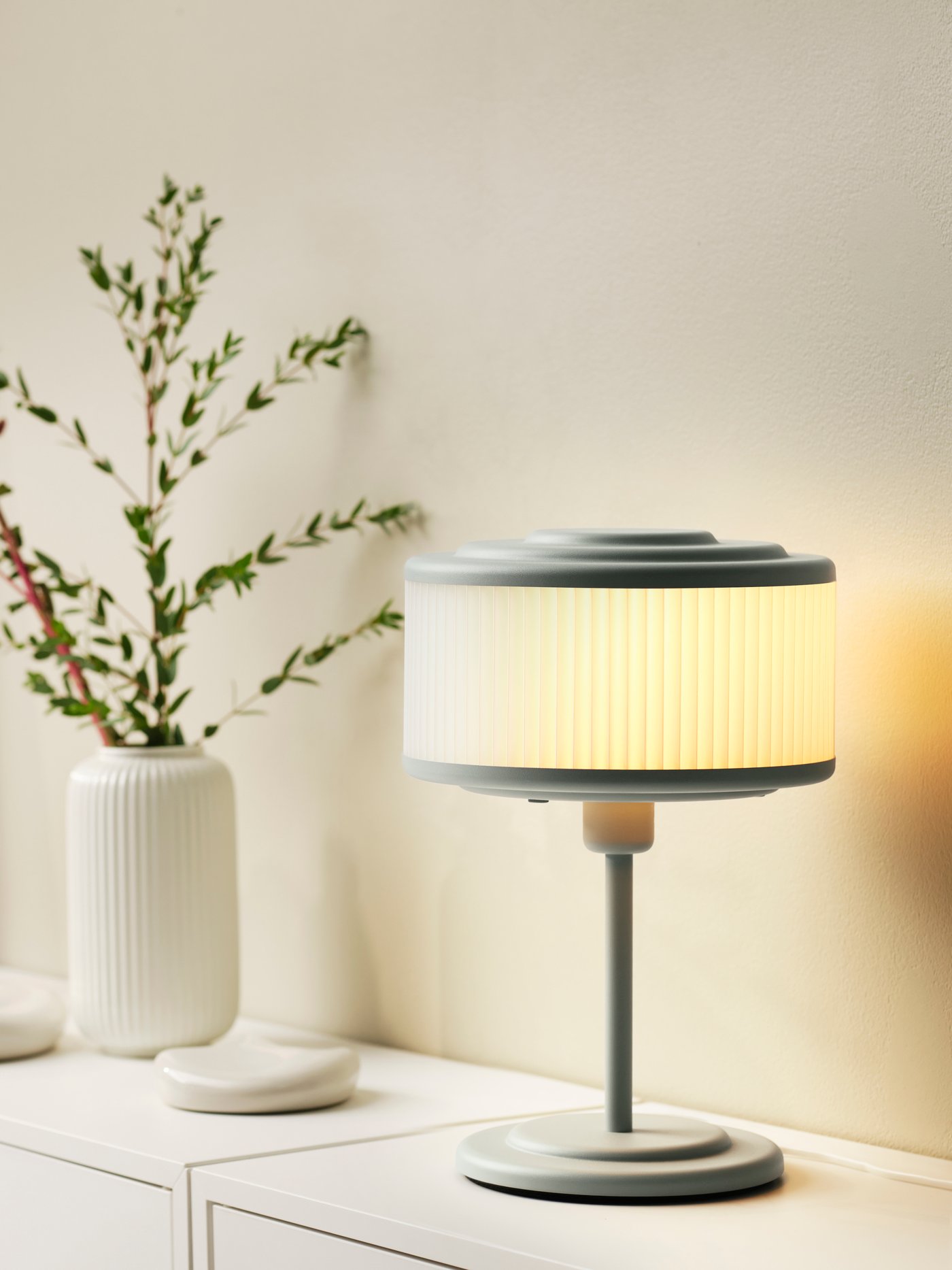 A grey-green REMTÅNG table lamp