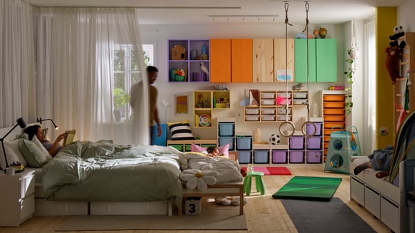 A pine IVAR shelving unit in the bedroom