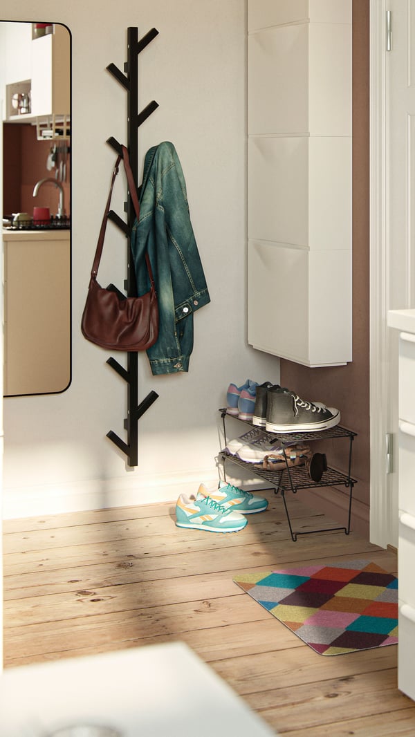 A grey GREJIG shoe rack in the hallway