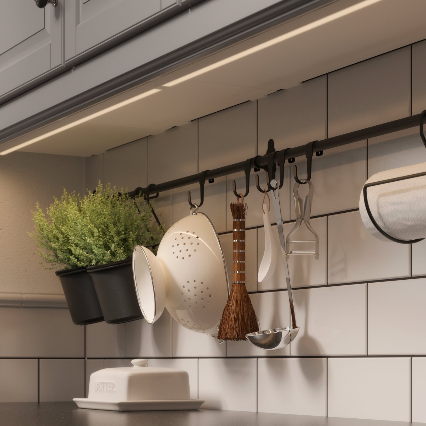 A dark grey PERSILLADE plant pot in the kitchen