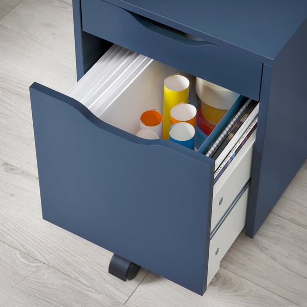 An opened drawer of a black-blue ALEX drawer unit on castors, showing different colours of paper rolls.