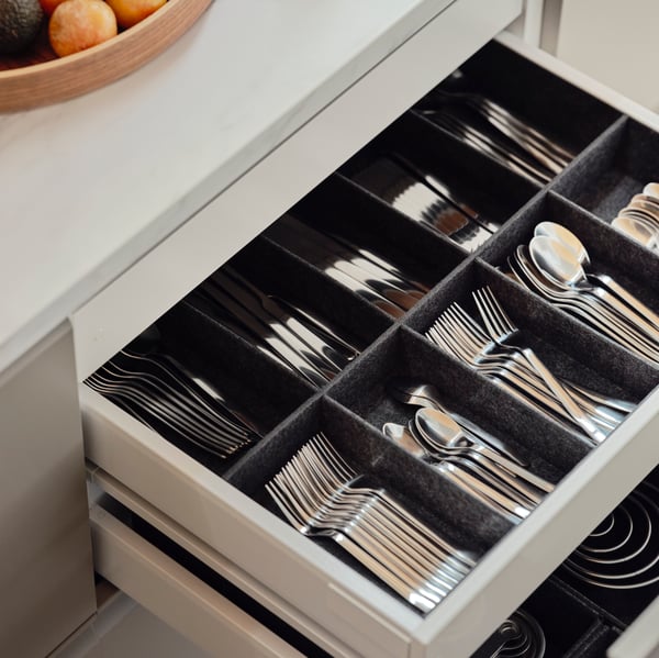 A grey UPPDATERA adjustable organiser for drawer