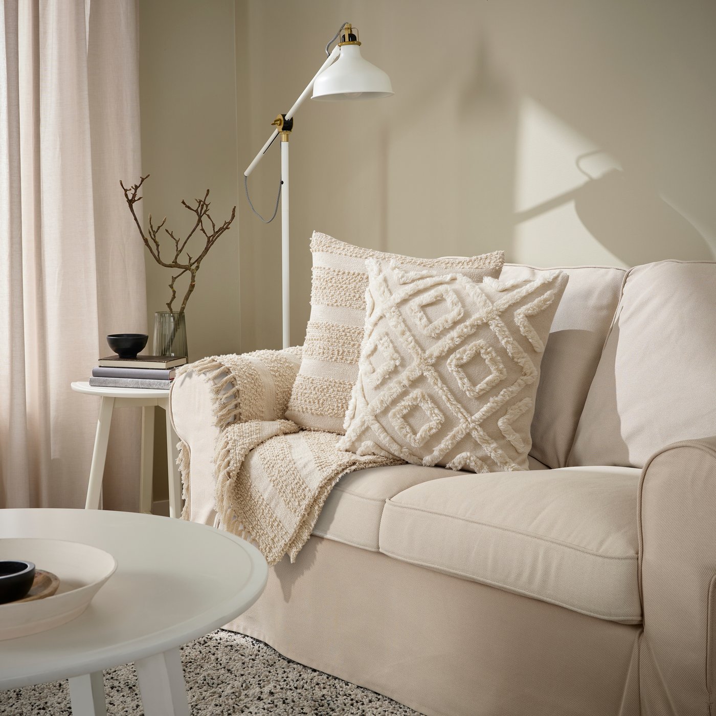 A natural GÖLSTARR cushion cover