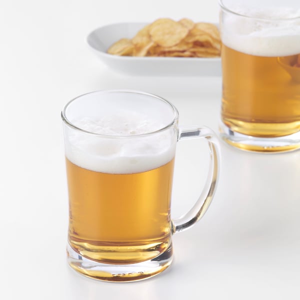 A clear glass MJÖD beer tankard