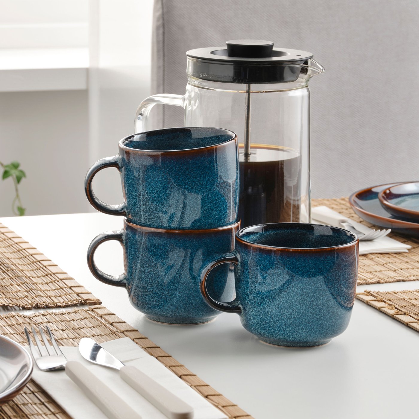 A blue GLADELIG mug