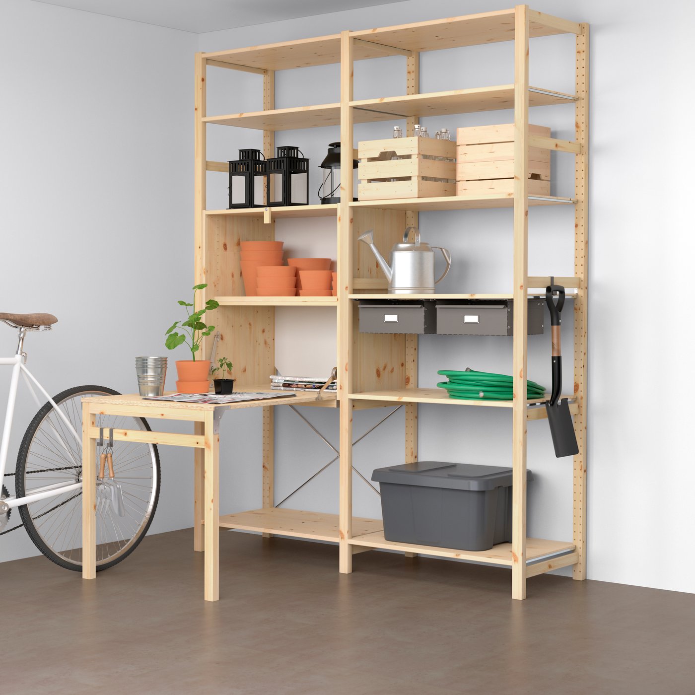 A wooden IVAR shelving unit with bins, sliding drawers, and even a fold-out table.