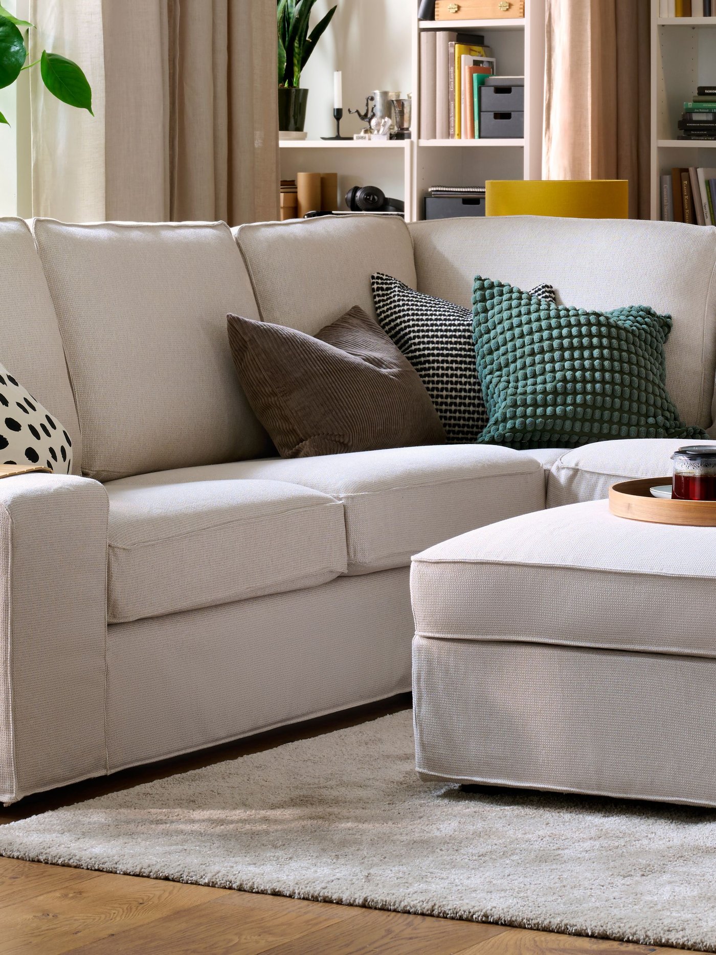 A Tresund light beige KIVIK corner sofa, 4-seat in the living room
