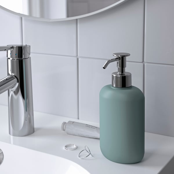 A light grey-turquoise EKOLN soap dispenser