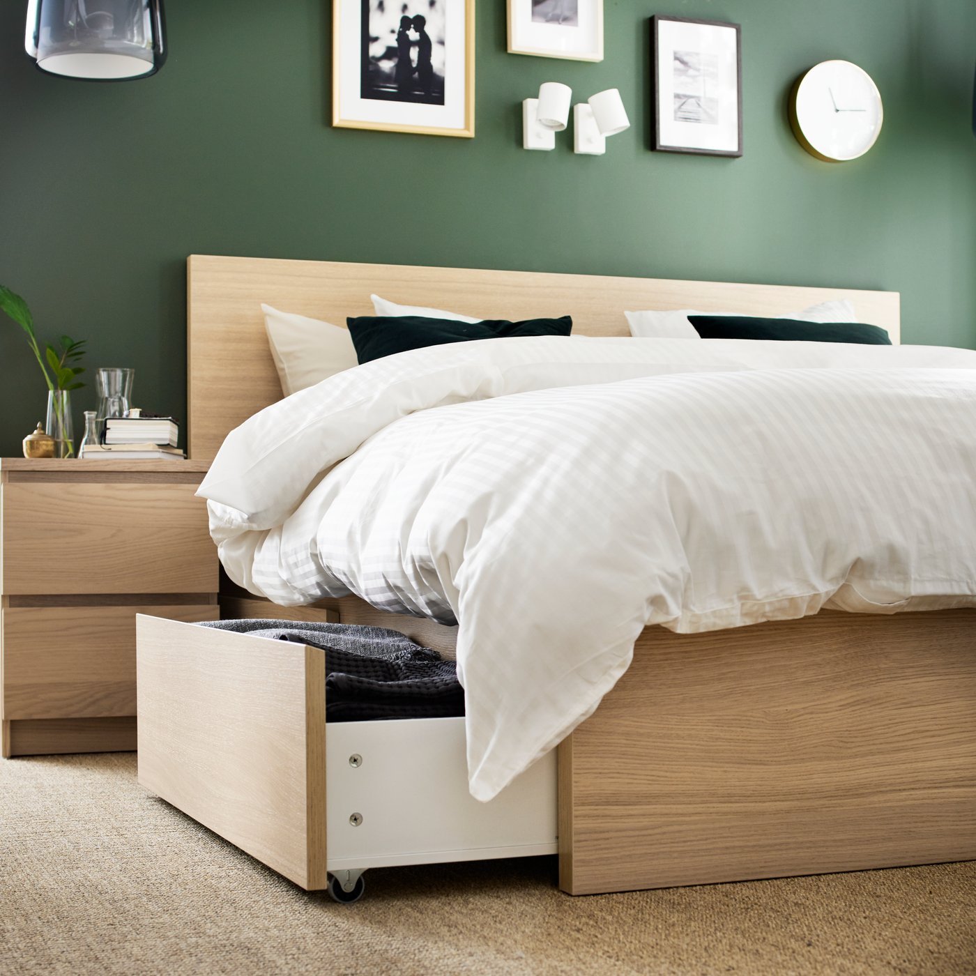 A white stained oak veneer MALM bed frame, high, w 4 storage boxes in the bedroom