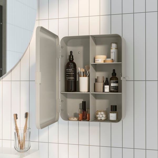 A grey-beige HUSBYÅN wall cabinet in the bathroom