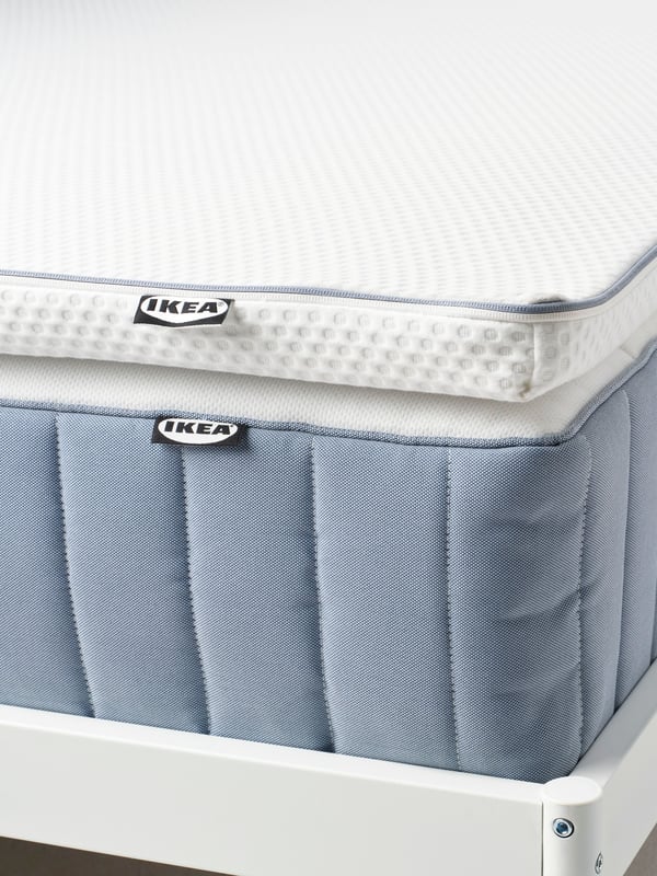 A white NÄSTABERG mattress pad