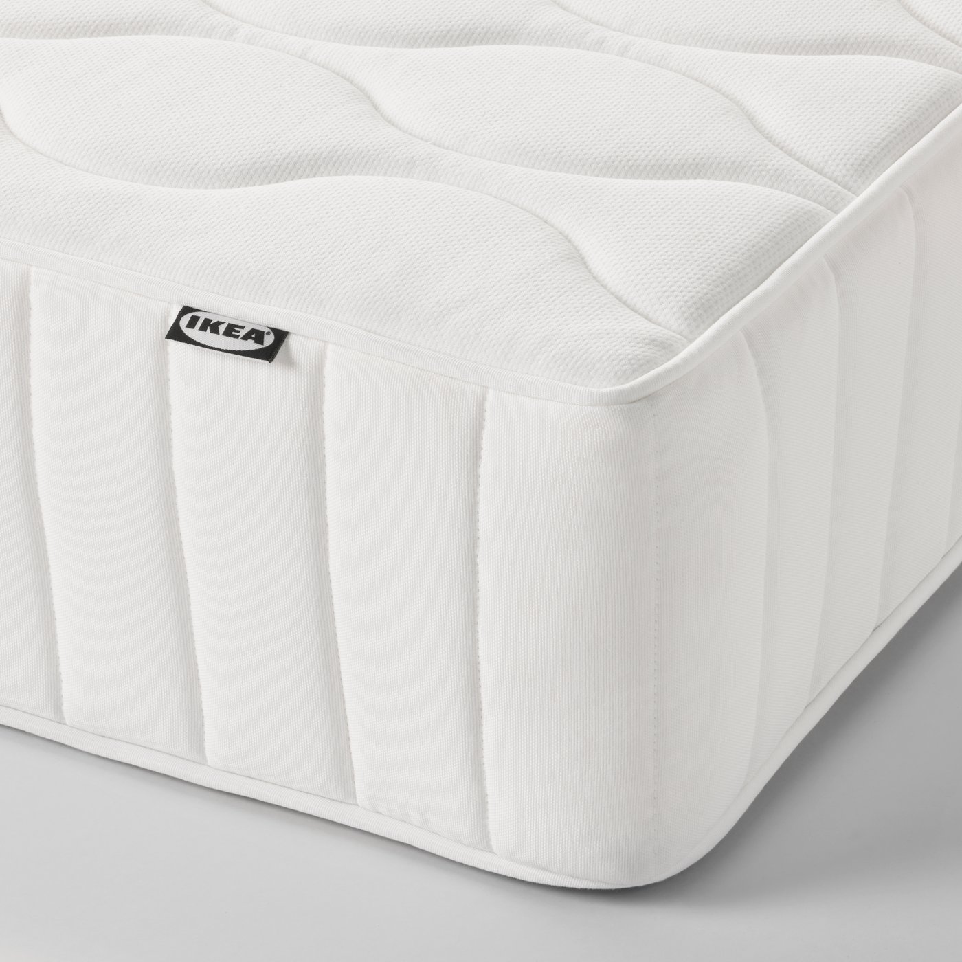 A medium firm/white VÅGSTRANDA pocket sprung mattress in the NA