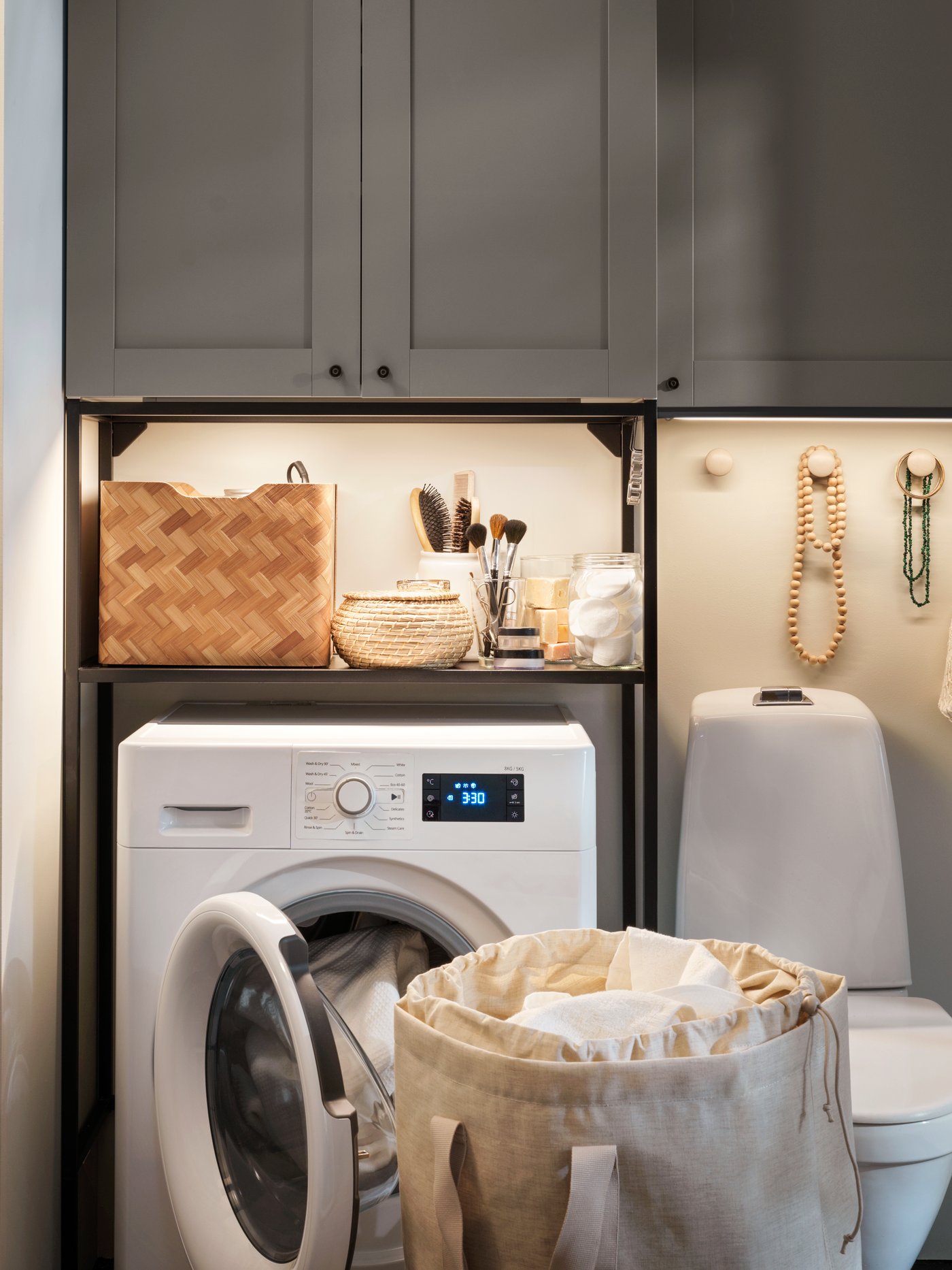 A beige PURRPINGLA laundry bag