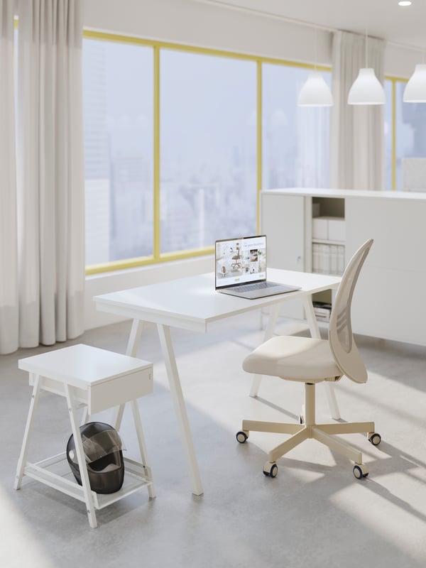 A white TJENA storage box with lid in the home office
