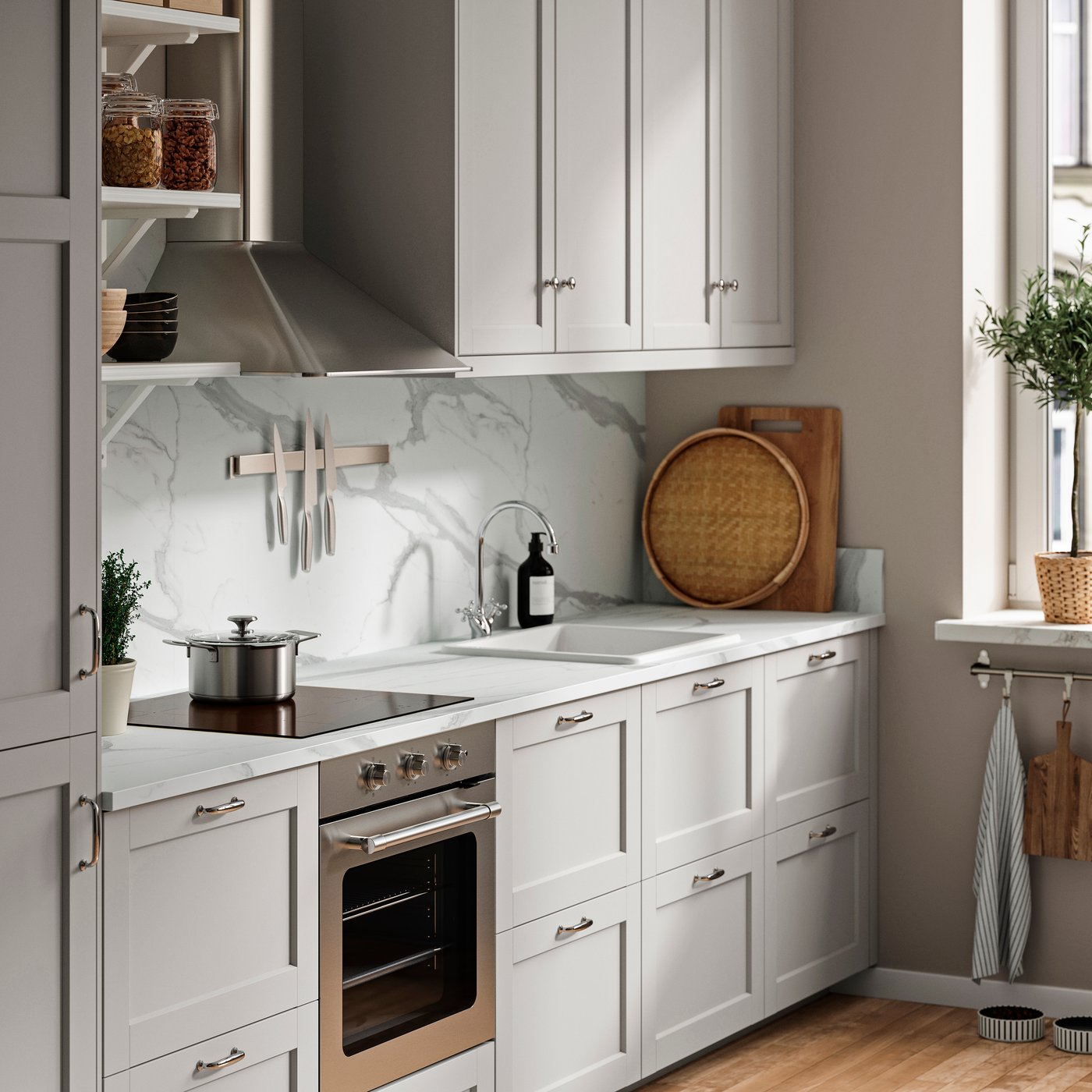 A grey shaker kitchen with a white marble laminate worktop.