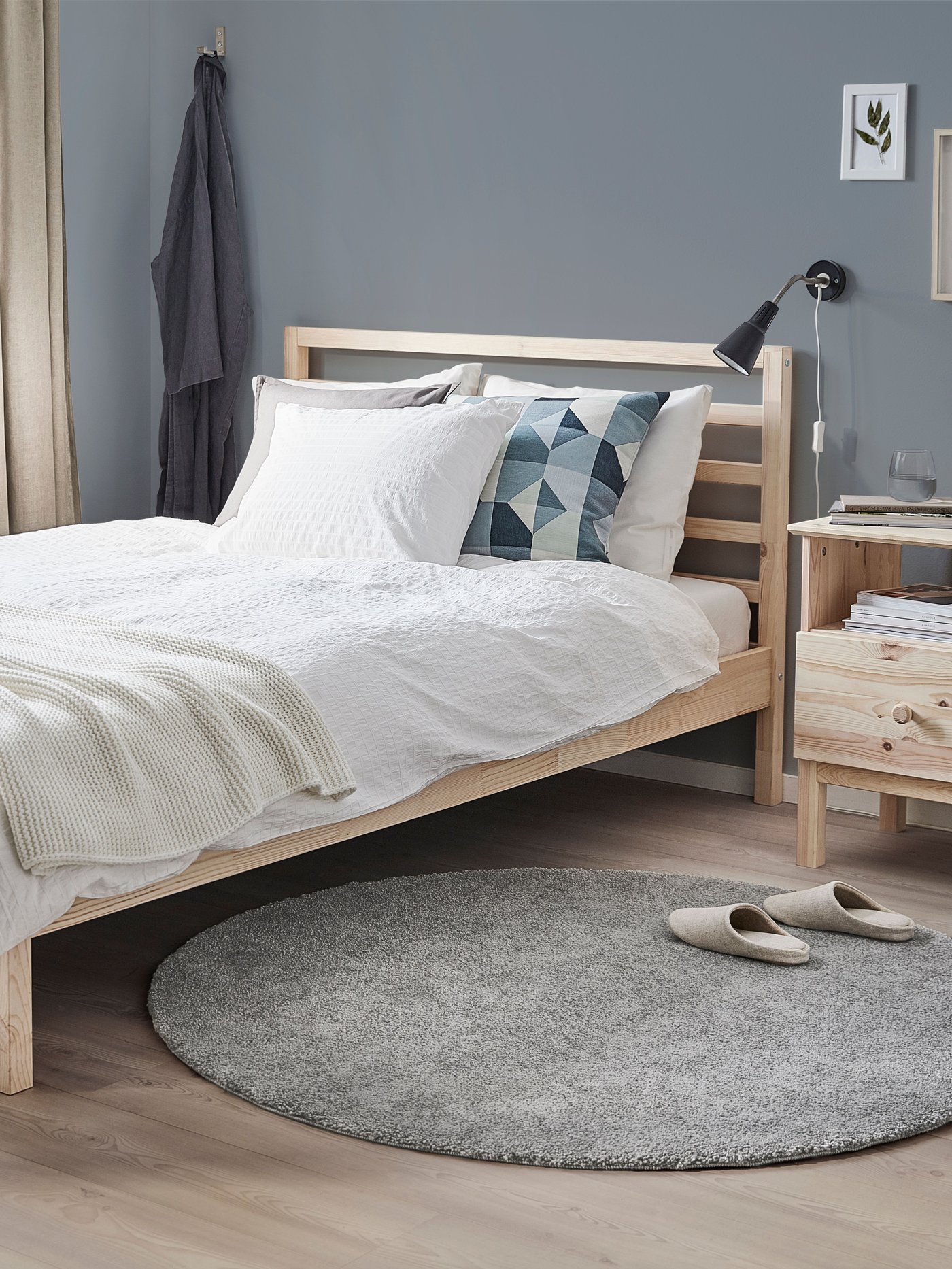 A pine TARVA bed frame in the bedroom