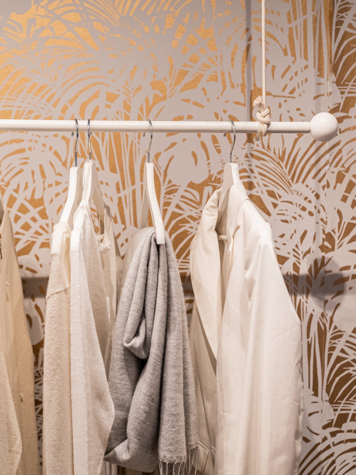 A white HUGAD curtain rod