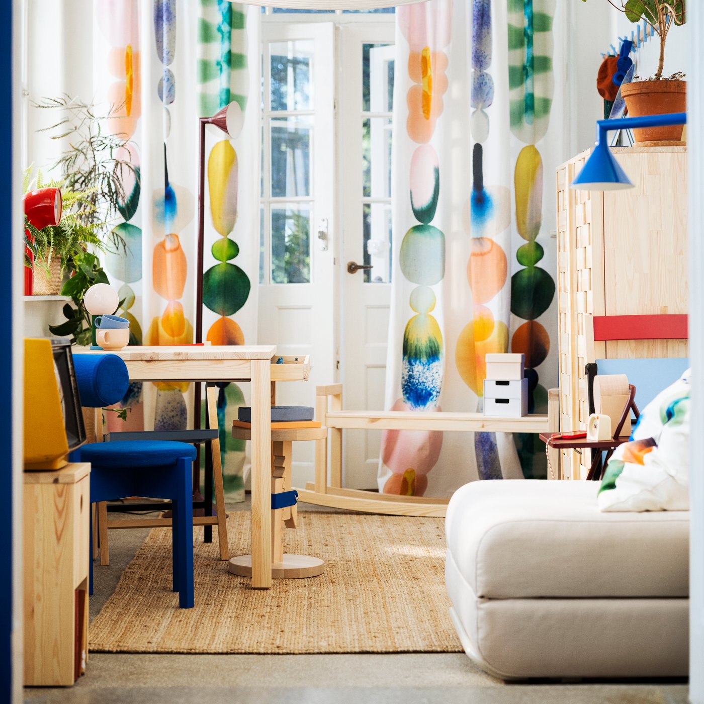 A small flat furnished with IKEA PS 2026 products, including a chair-bed and uplighter.