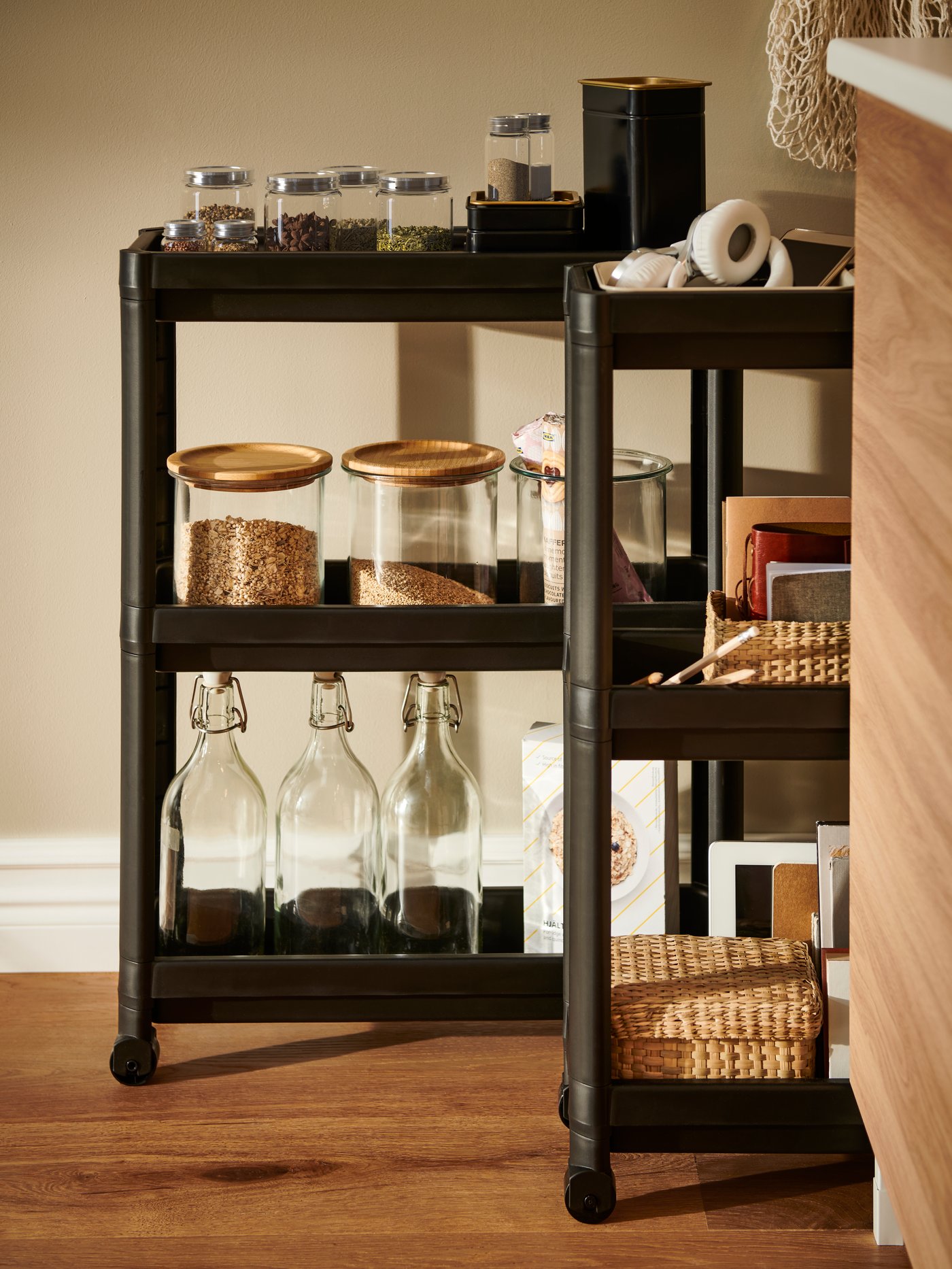 CITRONHAJ spice jars, IKEA 365+ jars with lid, KORKEN bottles and LURPASSA boxes on two black VESKEN trolleys.