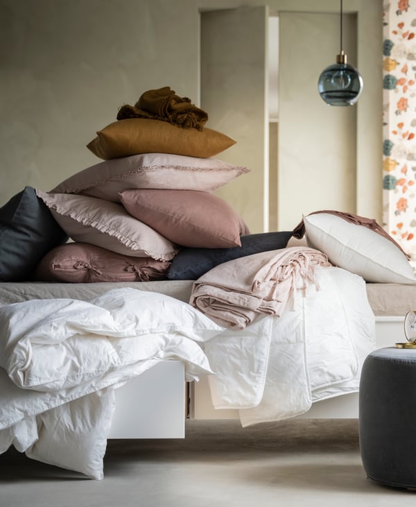 A dark golden-brown VIGDIS cushion cover in the bedroom