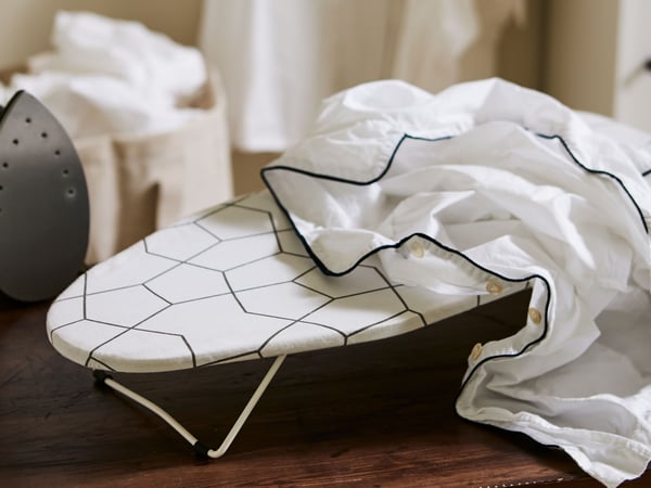 A JÄLL ironingboard, table in the laundry room