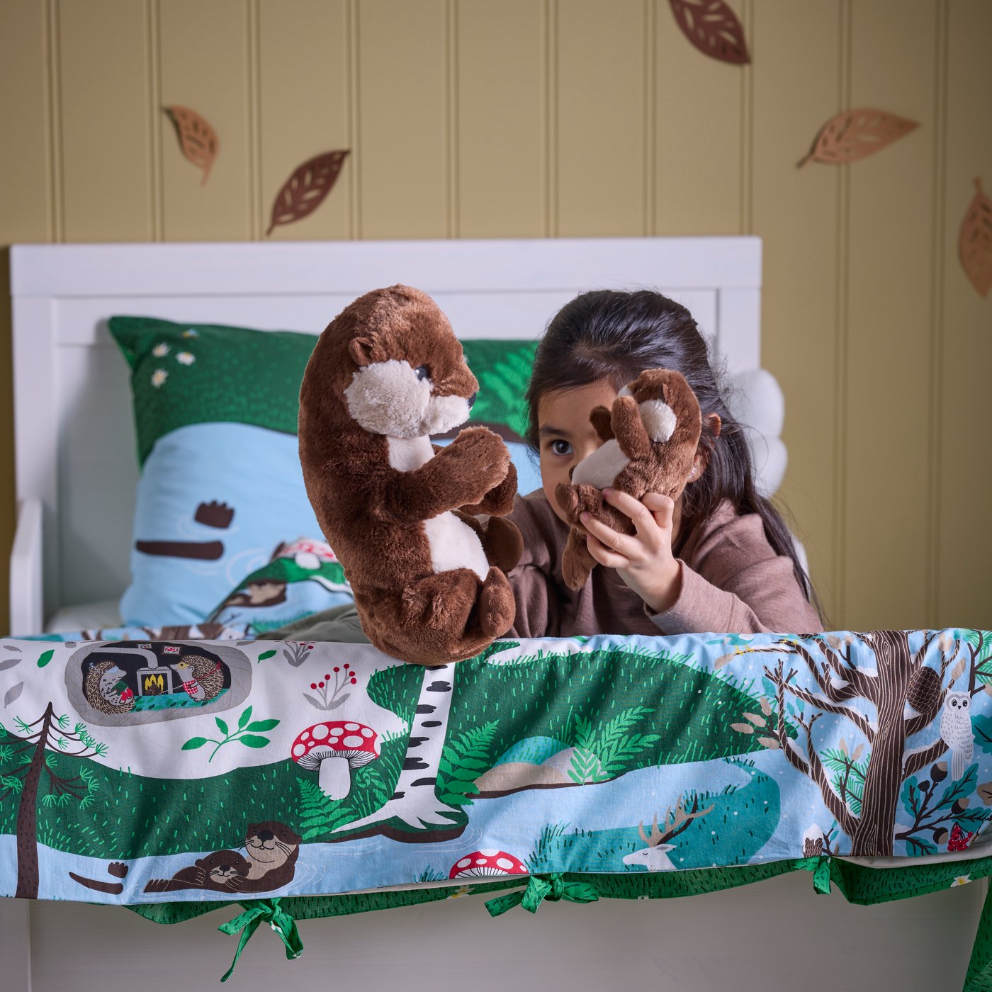 A blue green/forest pattern SKOGSDUVA duvet cover and pillowcase in the childrens room