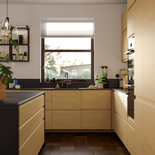 A well-planned kitchen with a FINSMAKARE forced air oven and storage for VOXTORP doors and drawer fronts.