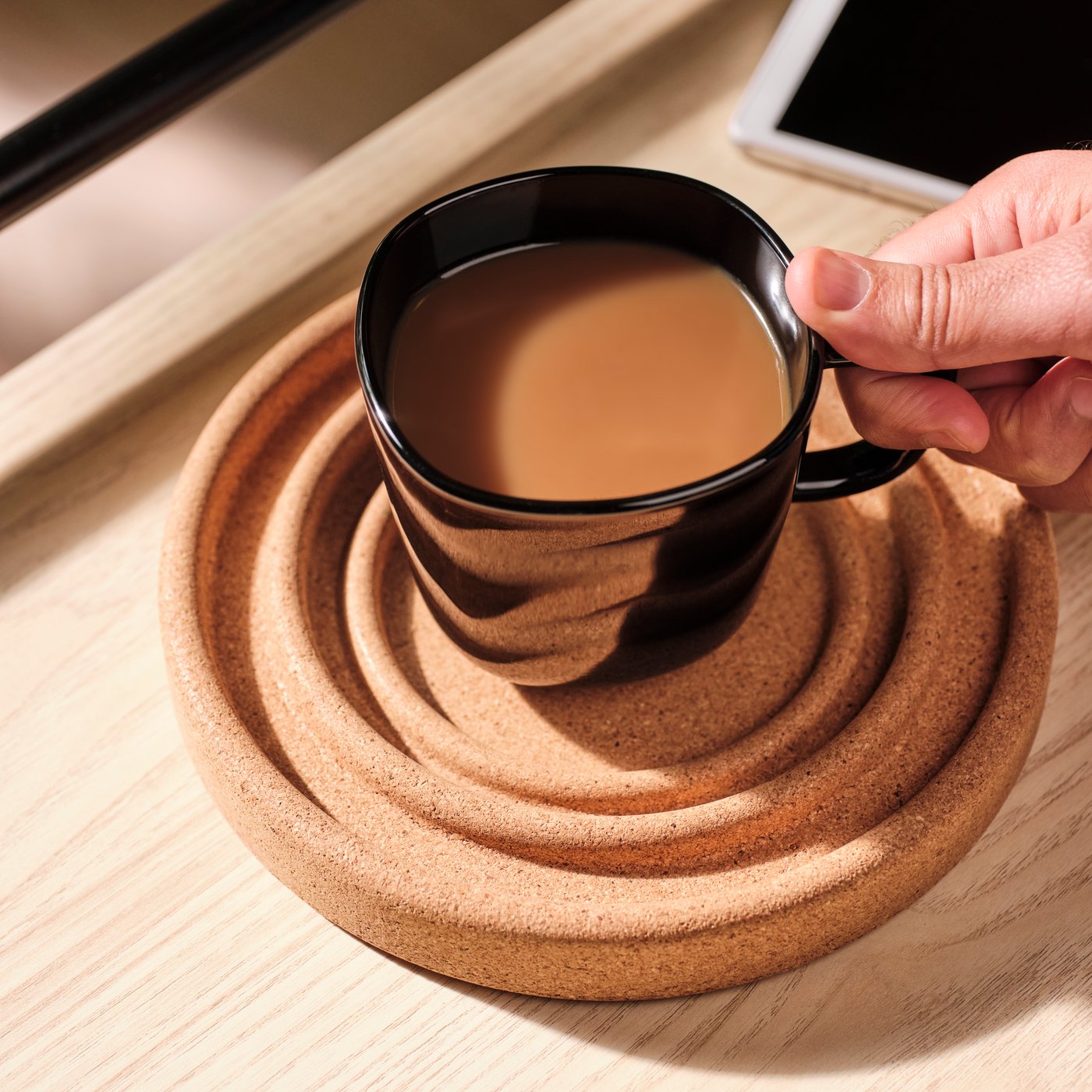 A cork BRÄNNBOLL coaster