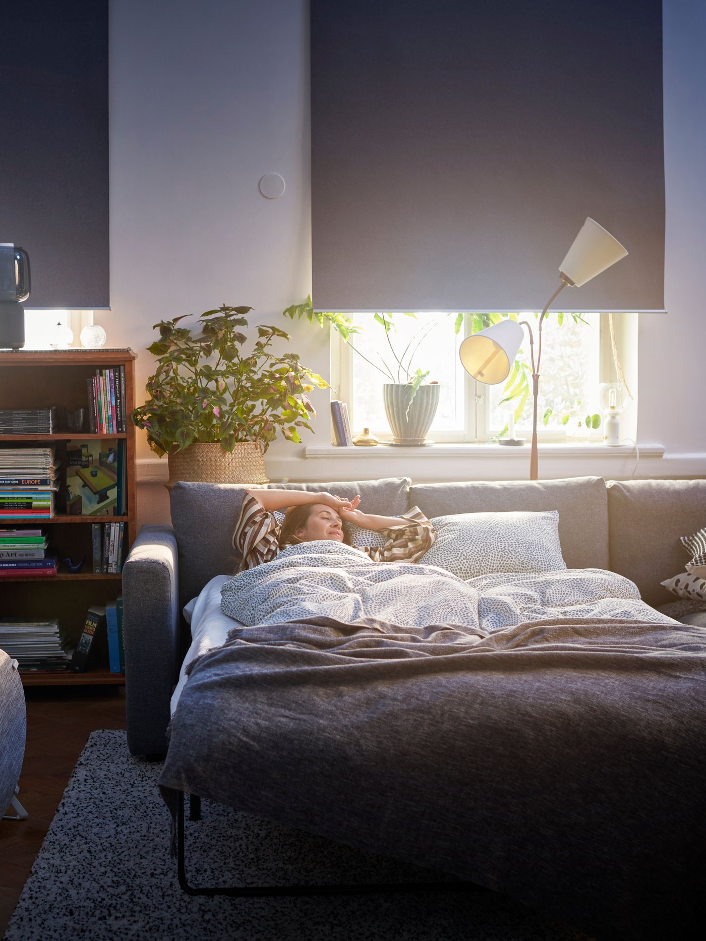 A black/smart SYMFONISK speaker lamp base with WiFi in the living room