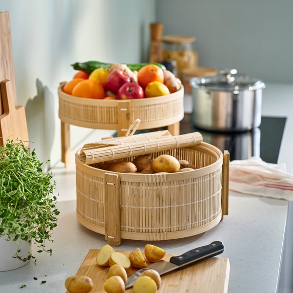 A bamboo KANELMOTT vegetable/fruit basket