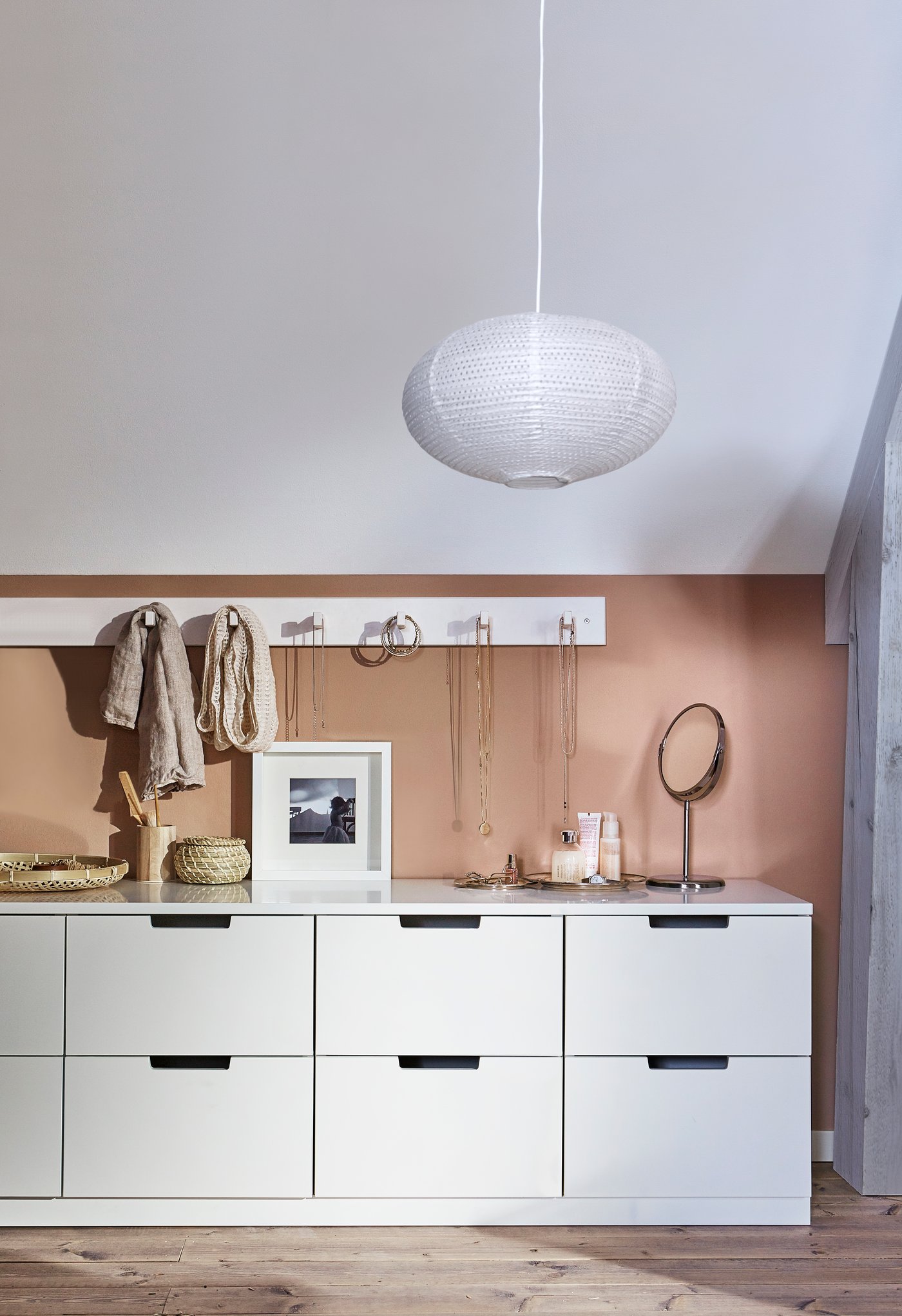 A white KUBBIS rack with 7 hooks in the bedroom