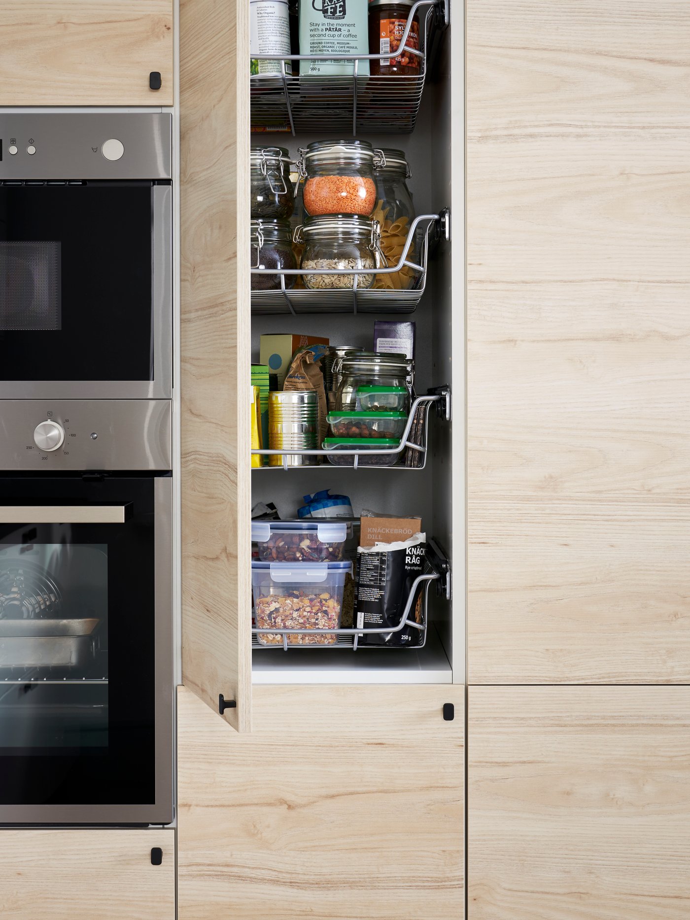 An UTRUSTA wire basket in the kitchen