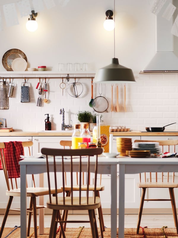 A white MATTRADITION wall mounted extractor hood in the kitchen