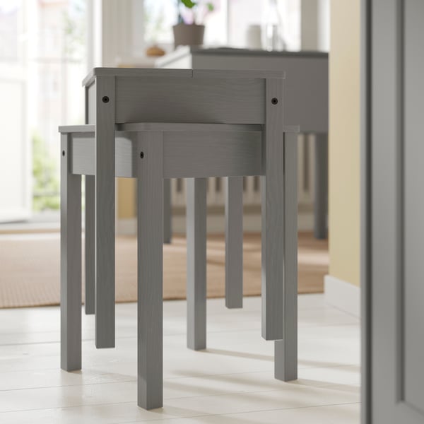 A grey/grey HAUGA table and 2 stools