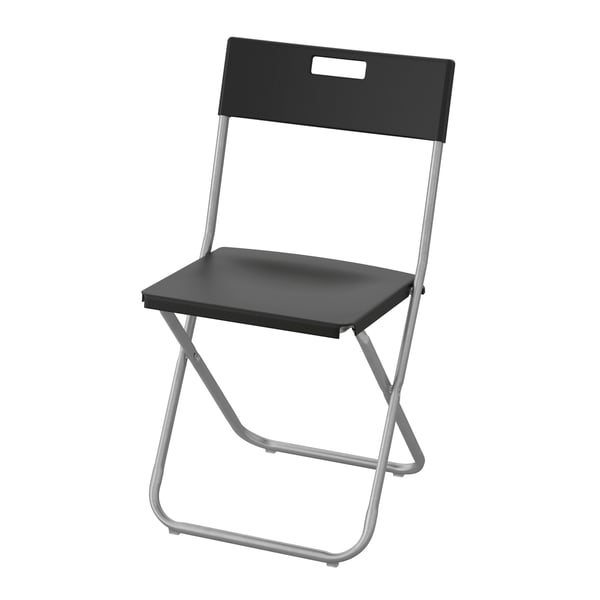 A black GUNDE folding chair