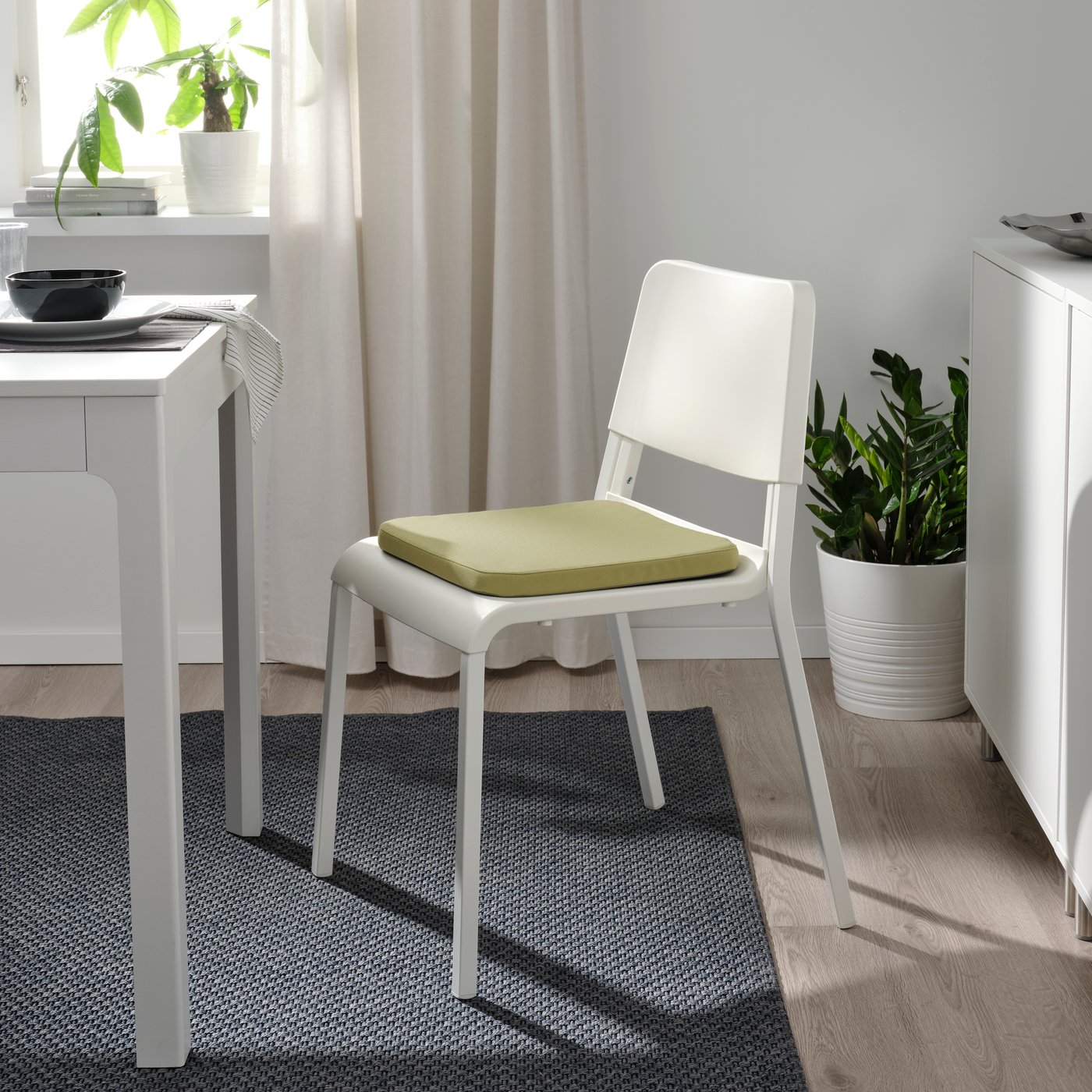 A beige-green STAGGSTARR chair pad