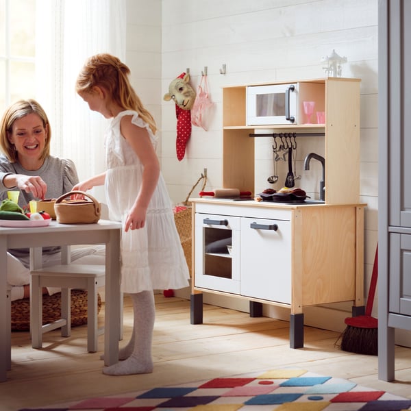 A DUKTIG kitchen with 7-piece toy baking set