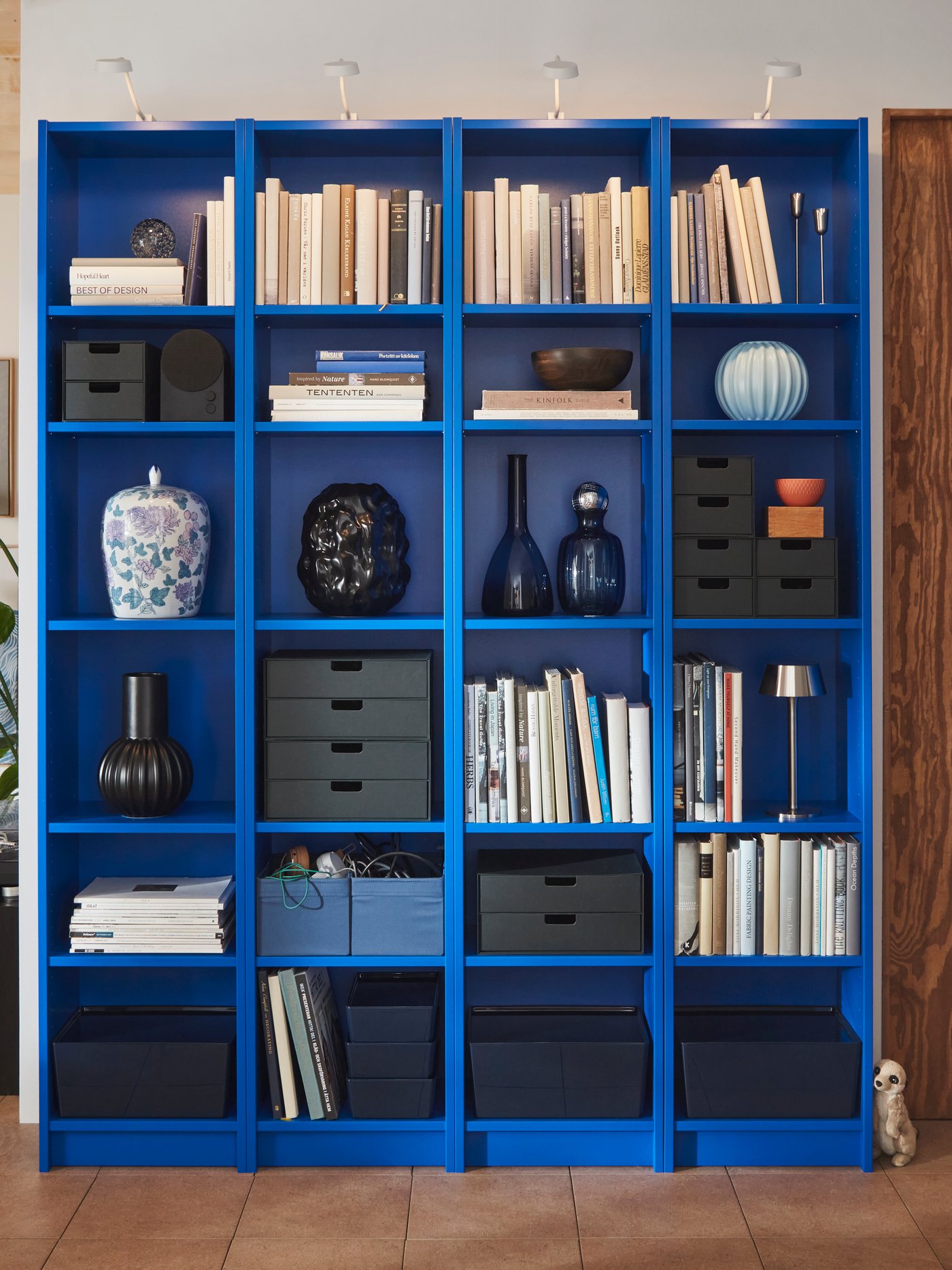 A Gunnared dark blue LILLESÄTER pouffe in the living room