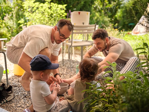 Family sat in a circle in the garden
