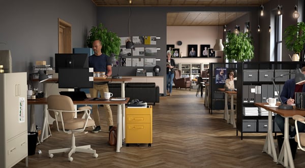A dark grey FJÄLLA storage box with lid in the home office