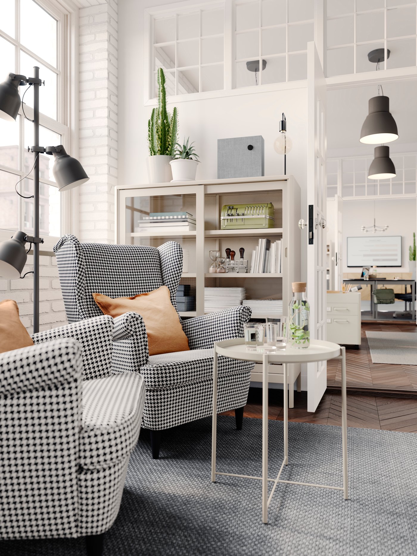 A dark grey HEKTAR floor lamp with 3-spot