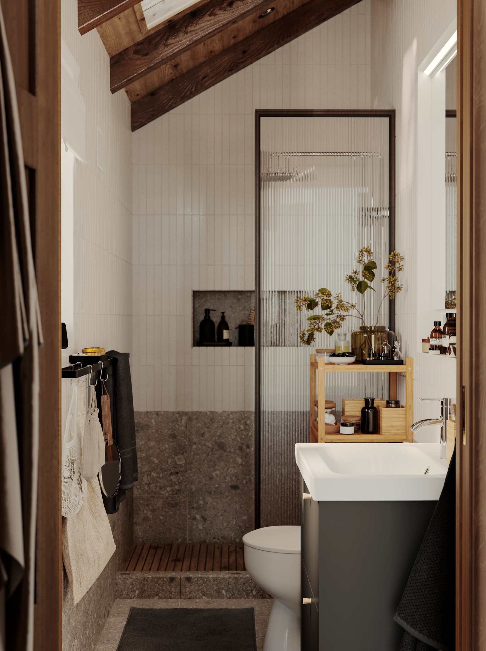 A small bathroom with a wooden ceiling has a shower wall, a dark grey HAVBÄCK wash-stand with drawers and a RÅGRUND shelf.