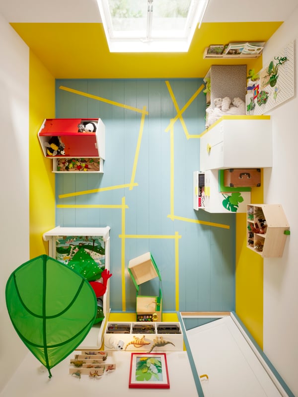 View of children’s room from above, with zones for different activities and functions marked out on the floor.